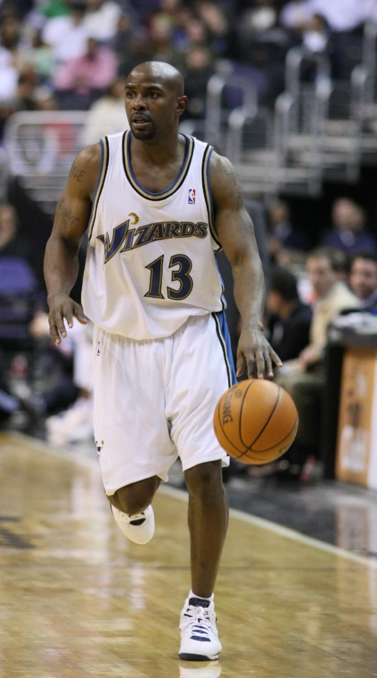 Mike James dribbles in a Washington Wizards jersey.